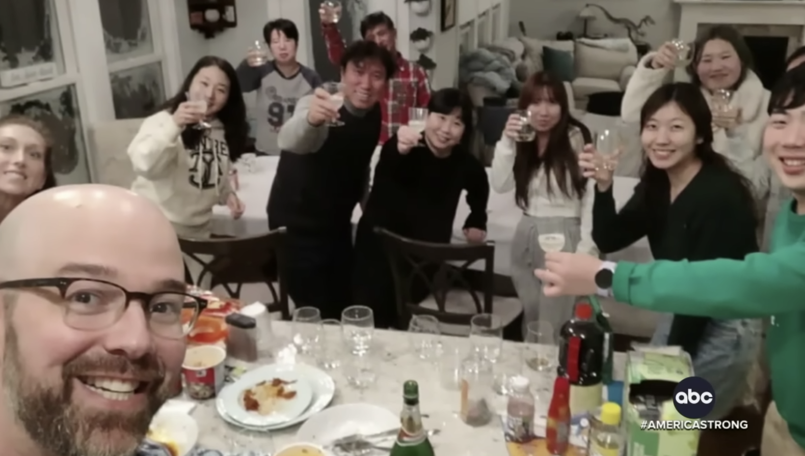 Buffalo, New York couple welcome stranded tourists from South Korea into their home.